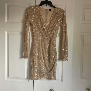 Gold sequence, dress size small. Long sleeve.